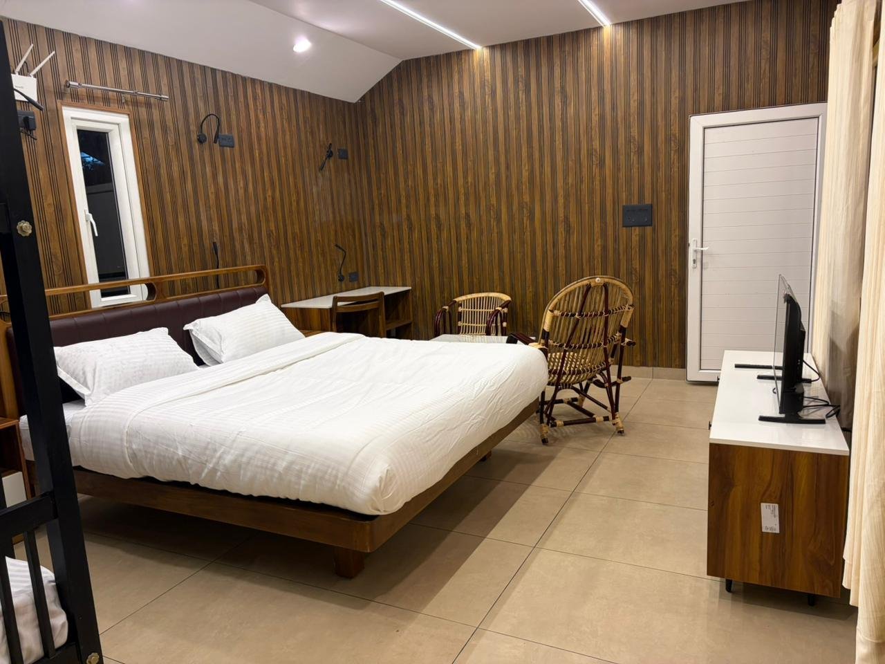 Double bedroom with TV unit at Misty Meadows