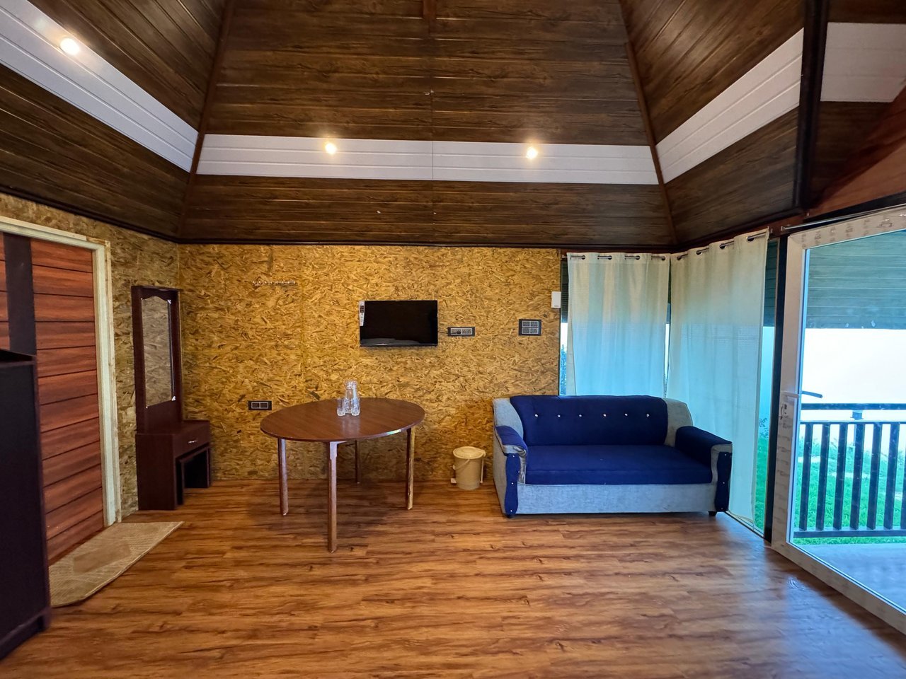 Sitting area with balcony door at Misty Meadows