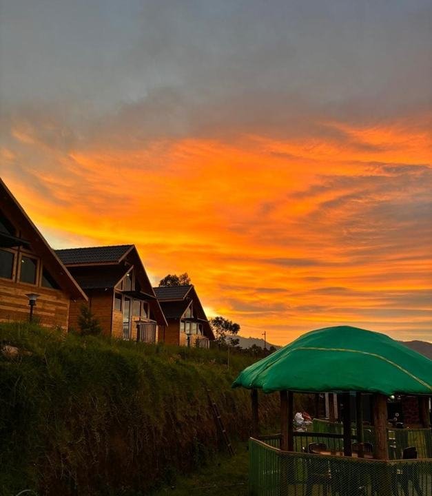 Sunset over the cottages at Misty Meadows