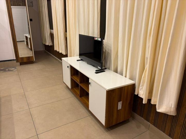 TV unit and curtains at Misty Meadows